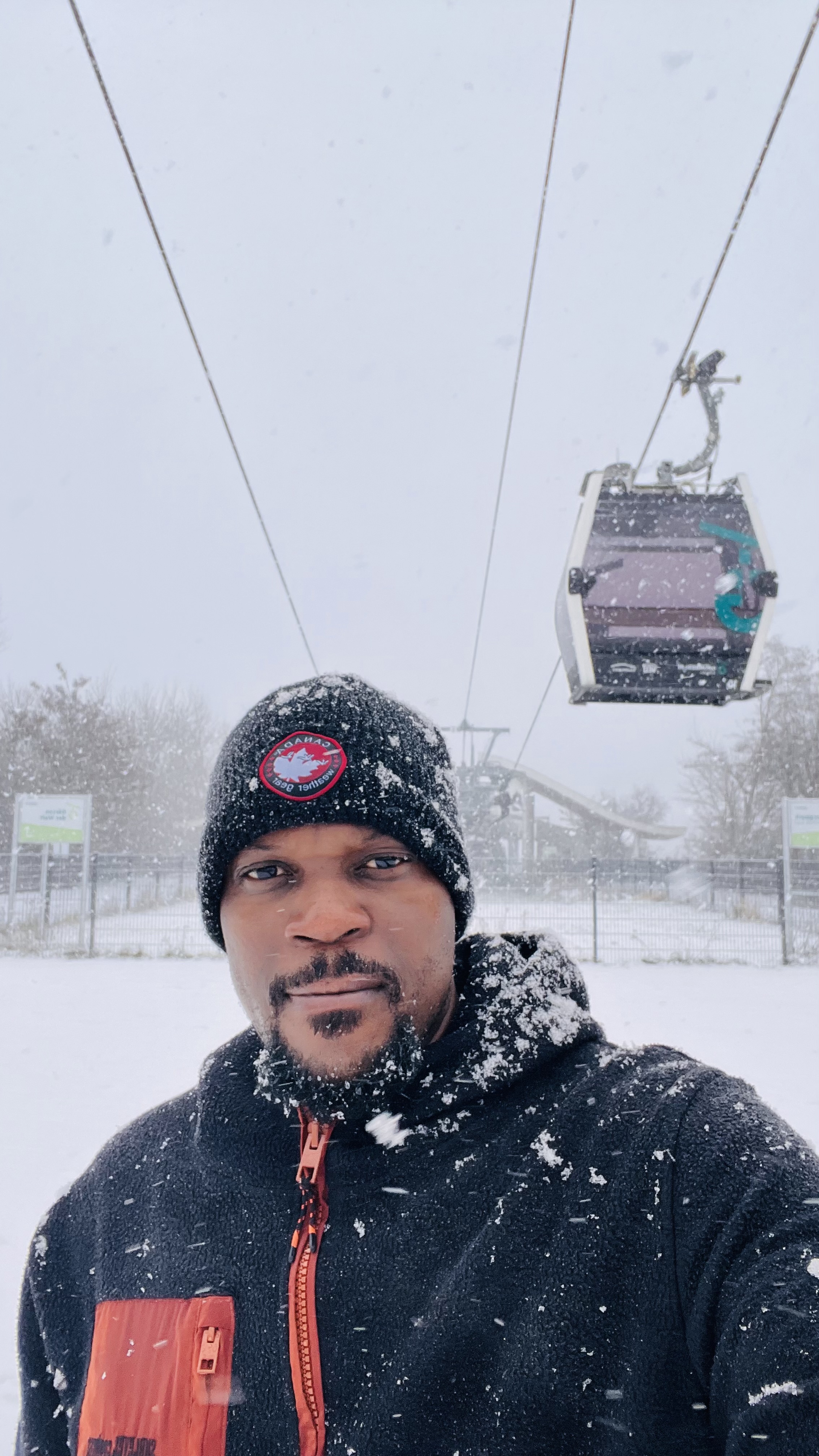 Portrait of Emeka in a snowy outdoor setting.